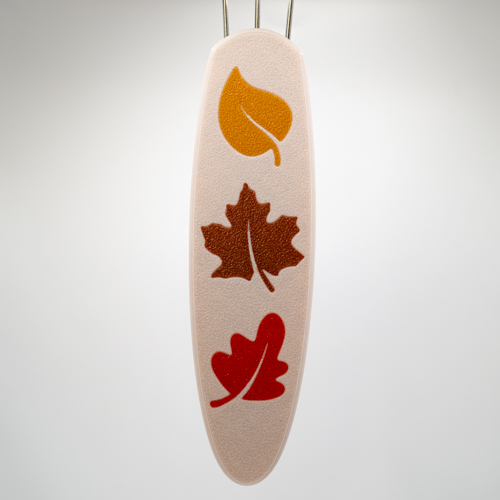 Fall Leaves Cordsmith. A beige handle with gold, bronze and magenta leaves down the handle vertically. The colors of the leaves change order depending on the handle size.